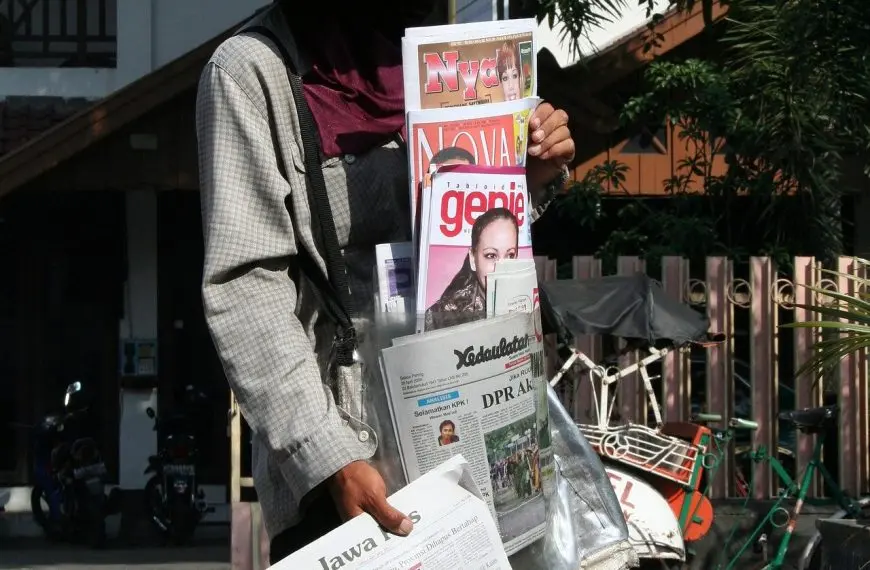 person selling newspapers