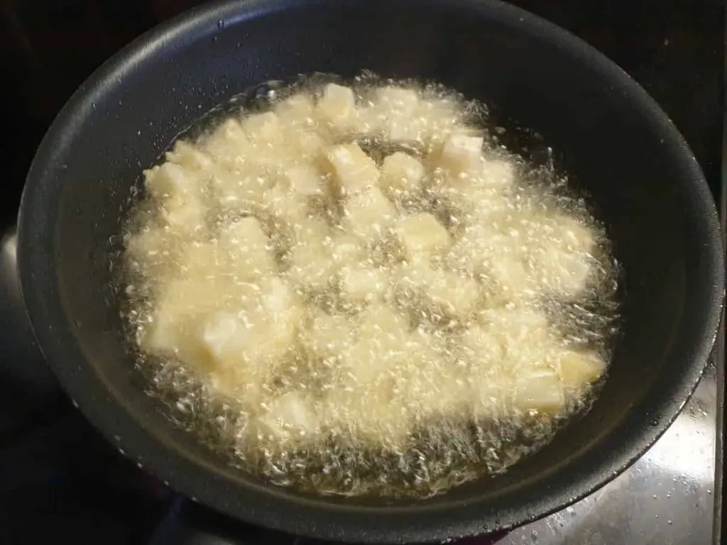 Frying celeriac in pan