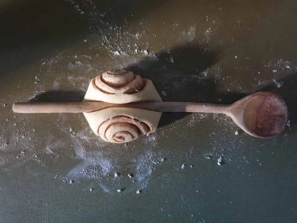 Shaping the cinnamon rolls