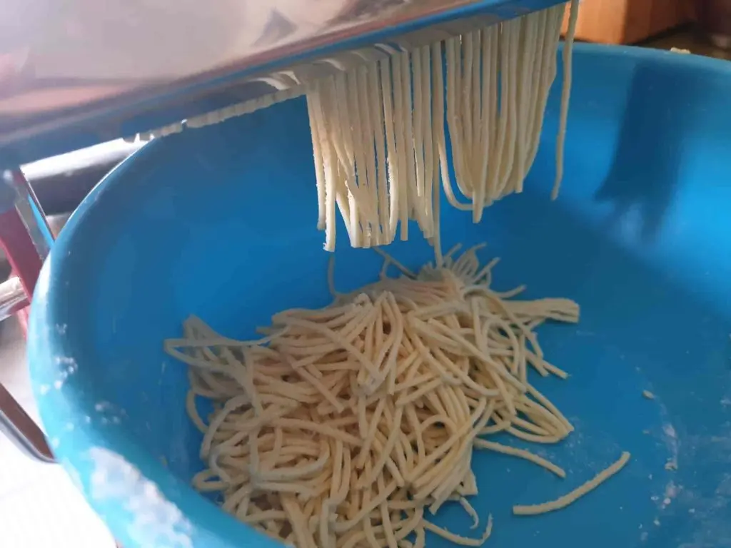 Swabian soup noodles being cut