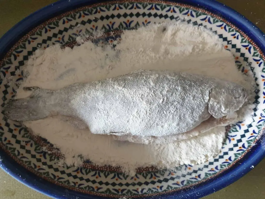 Dusting the trout with flour