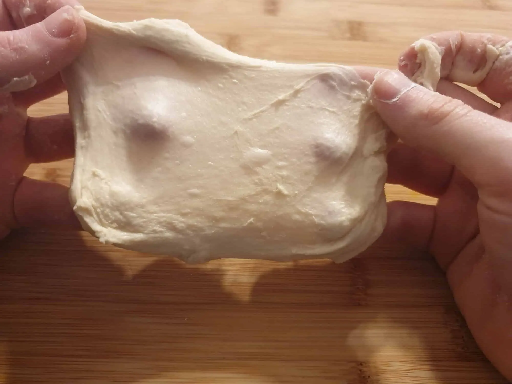 Windowpane test to check if the dough has been properly kneaded