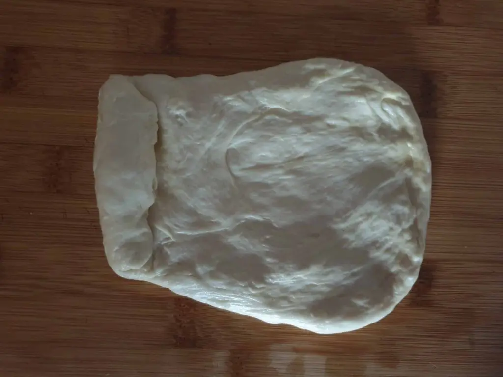Rolling the dough into a cylinder