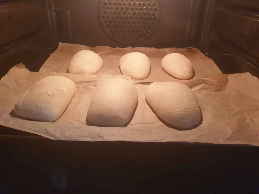 Ciabatta rolls of the first batch in the oven