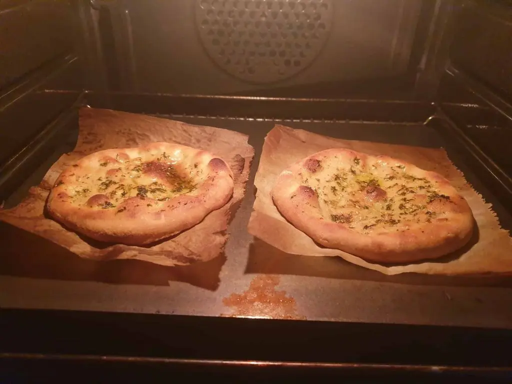 Baking the flatbreads in the hot oven