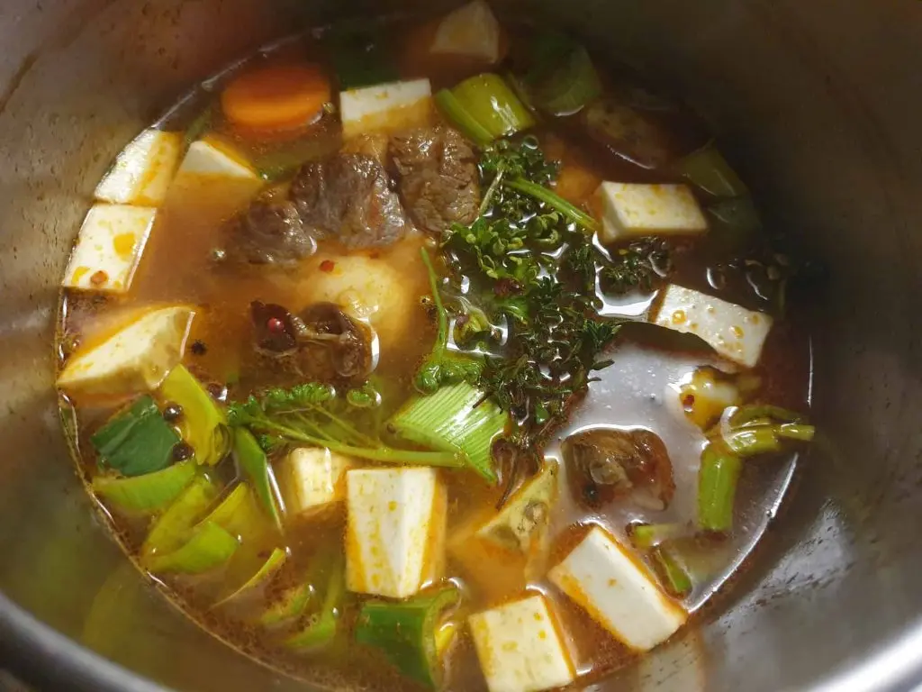Oxtail soup simmering on the stove
