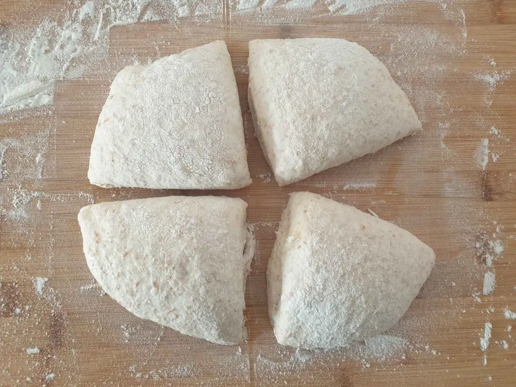 Dividing the dough into 4 whole grain ciabatta rolls