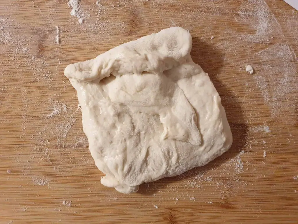 Flattening the dough ball