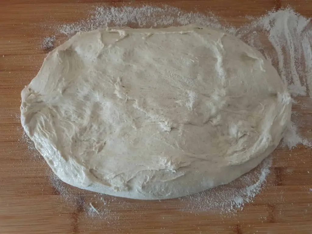 Spreading the dough out on a floured work surface